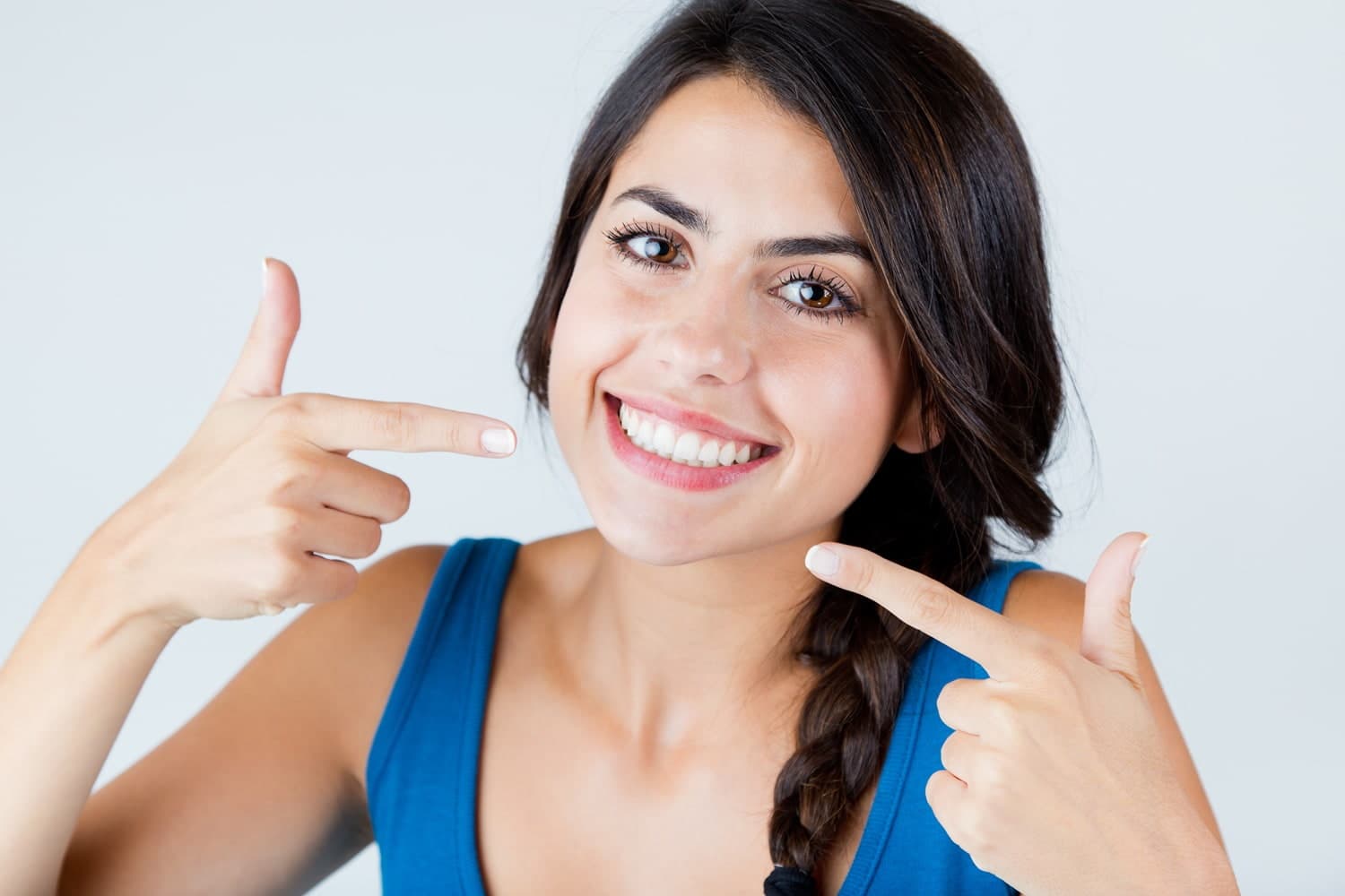Featured image for What Are the Tiny Tooth-Coloured Bumps the Dentist Glues to Your Teeth During Aligner Treatment?